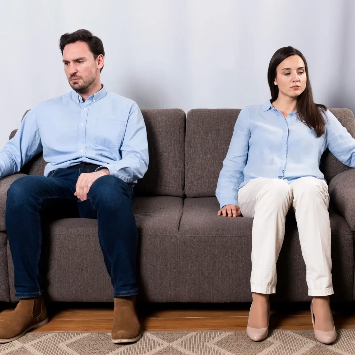 angry-male-woman-sitting-couch